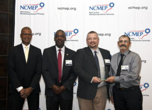 L-R: Kenny Flowers, NC Department of Commerce Assistant Secretary; Phil Mintz, Executive Director Industry Expansion Solutions and North Carolina Manufacturing Extension Partnership; Chuck Jarrell, 3M Plant Engineering Manager; Garry Krontz, 3M SIC Maintenance Leader