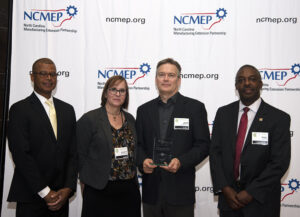 L-R: Kenny Flowers, NC Department of Commerce Assistant Secretary; Elizabeth Jennings, Equilibar Marketing; Jeff Jennings, Equilibar Founder / President; Phil Mintz, Executive Director Industry Expansion Solutions and North Carolina Manufacturing Extension Partnership